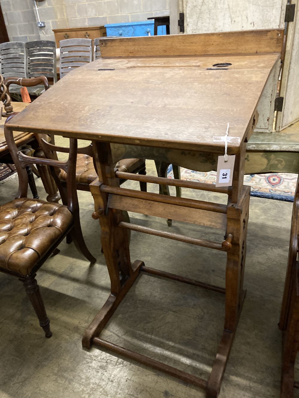 A 19th century Continental oak metamorphic rise and fall students desk together with a matching chair, desk width 66cm